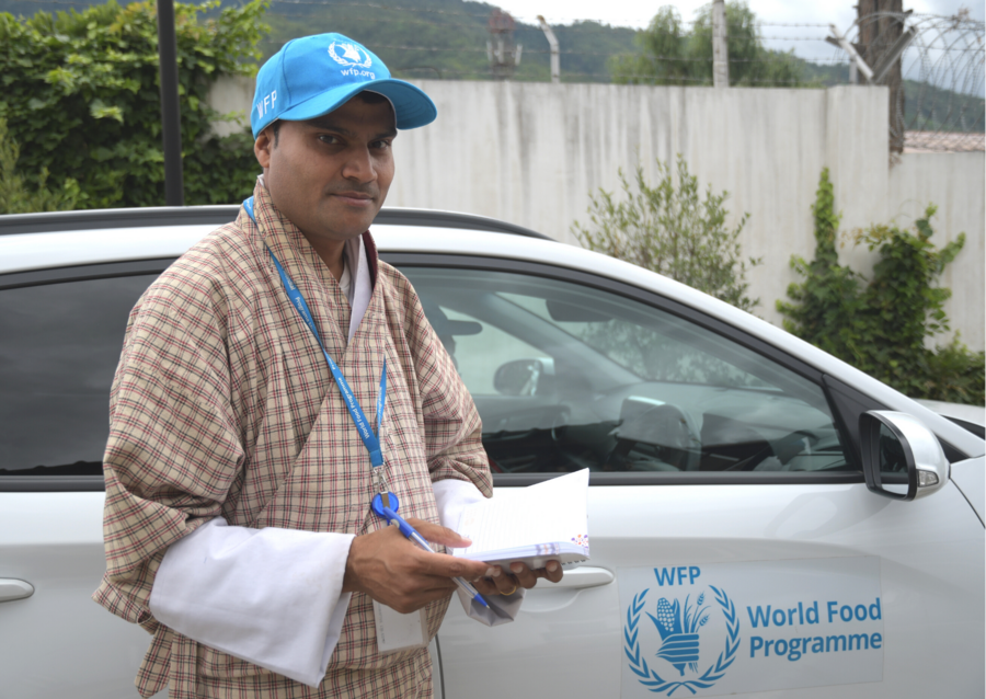 Man stood next to WFP car