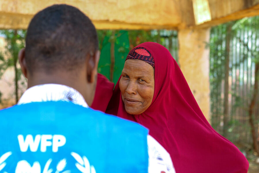 Faduma Mohamed Adan, 54, speaks to a WFP staff member at the Kabasa health centre in Dolow, Somalia.patrick mwangi