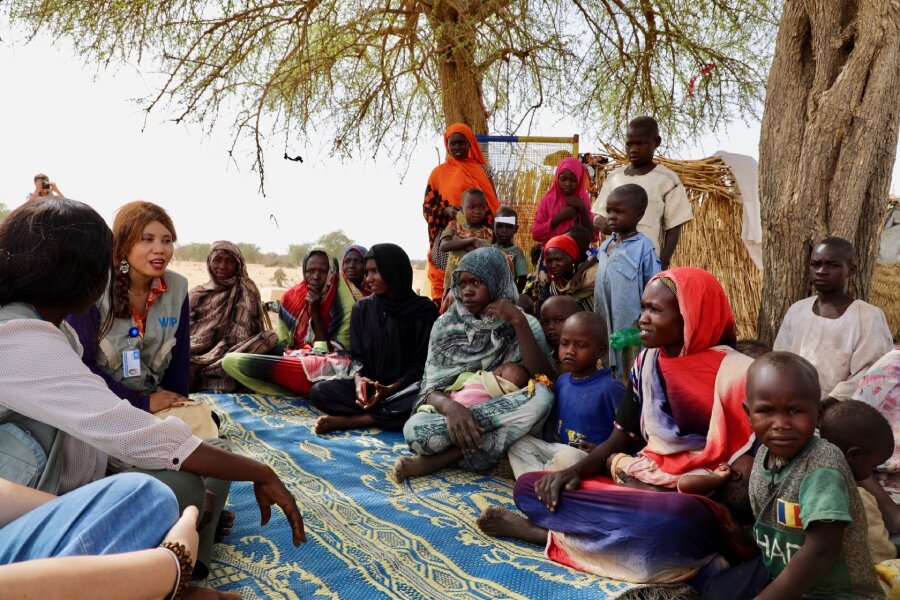 WFP and other humanitarian workers speak to new Sudanese arrivals in Chad. WFP is distributing food, but a funding crunch threatens future assistance. Photo: WFP/Jacques David