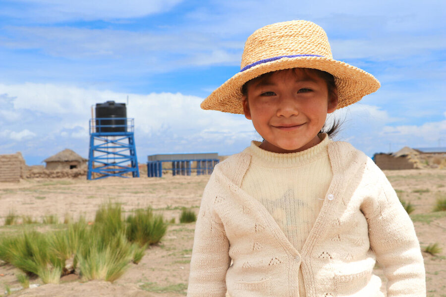 Uru girl in Bolivia in front of a fish farm installed by WFP Bolivia. WFP/Divha Gantier