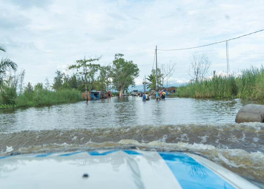 WFP car cuts through floods