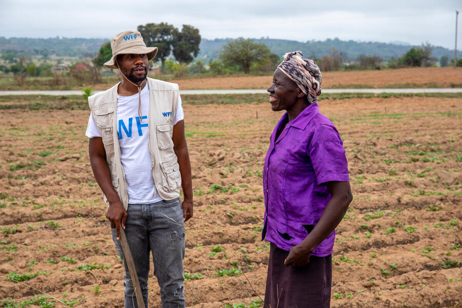 Smallholder farmer Margret speaks with WFP Communications Associate Tatenda Macheka in her field near her home in Masvingo, Zimbabwe.