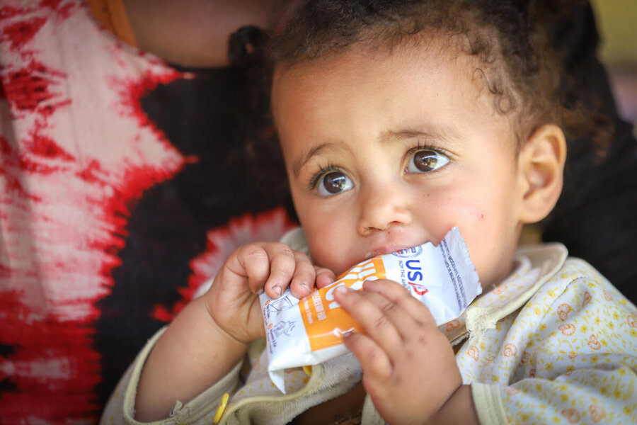 A child eating WFP nutrition supplement